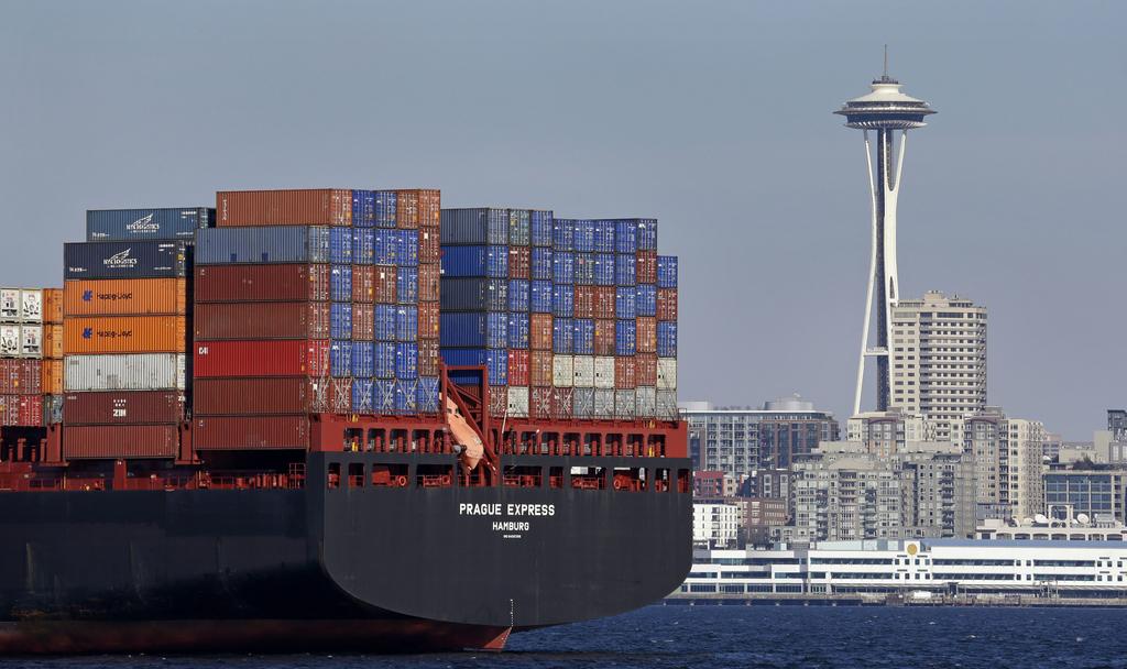 Above, Chinese goods on the way to the United States. Elaine Thompson / AP Photo