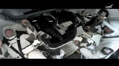 Mr Wilmore and Ms Williams sit inside a SpaceX Crew Dragon capsule in preparation for undocking from the ISS to begin their return to Earth. Photo: Nasa / Reuters