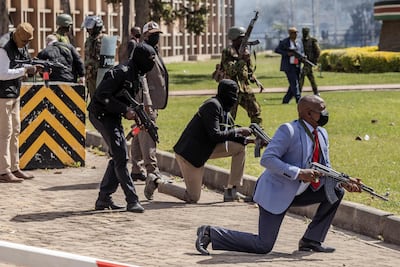 Armed Kenyan police and security personnel outside the parliament building. AFP