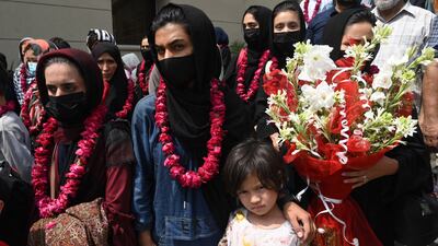 Members of Afghanistan's national girls football team arrive at the Pakistan Football Federation in Lahore on September 15, 2021, a month after the hardline Taliban swept back into power. AFP
