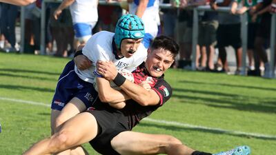 A Dubai English Speaking College player is tackled.