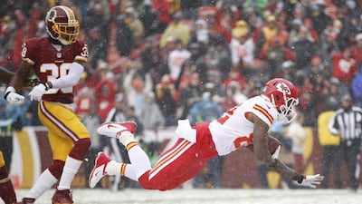 Kansas City's Dwayne Bowe scores a touchdown in the Chiefs' 45-10 win over the Redskins in Washington. Evan Vucci / AP