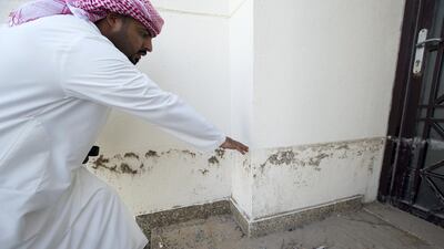 Jasim Al Abdouli shows how high the water rose on October 5