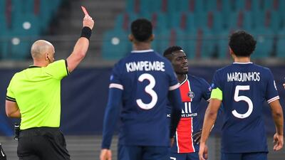 Referee Szymon Marciniak shows the red card to Idrissa Gueye. EPA