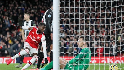 Arsenal's Nicolas Pepe, left, after scoring his side's second goal. AP