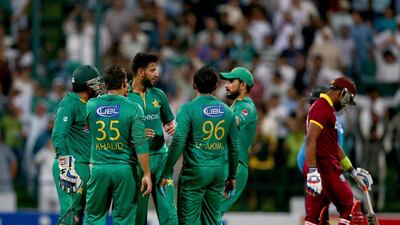 Imad Wasim of Pakistan celebrates with teammates after dismissing Dwaine Bravo of the West Indies during the third T20 International match between at Zayed Cricket Stadium on September 27, 2016 in Abu Dhabi. Francois Nel / Getty Images