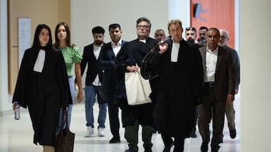 Lawyers and relatives of victims arrive at the trial in Paris. AFP