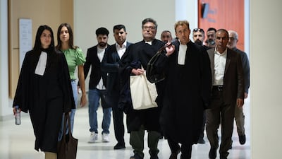Lawyers and relatives of victims arrive at the trial in Paris. AFP