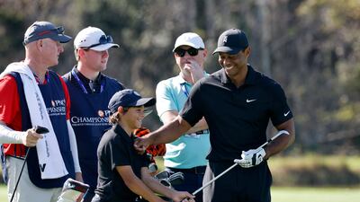 Tiger Woods with his son Charlie on the 14th. Reuters