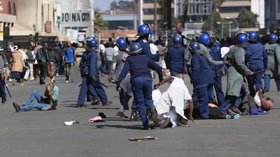 Riot police arrest and forcibly apprehend protestors. AP Photo