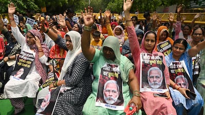 Members of All India Magila Congress hold placards with a message reading 'Modi break your silence on Manipur' during a protest over sexual violence against women and ethnic violence in the north-eastern state. AFP