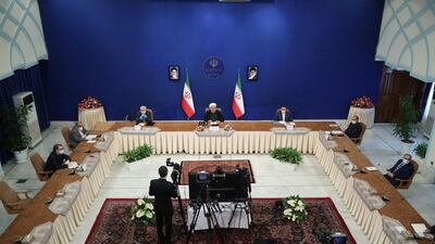 A handout picture provided by the Iranian presidency, shows President Hassan Rouhani, centre, speaking at a televised videoconference meeting of the Non-Aligned Movement (NAM) in the capital Tehran.. AFP