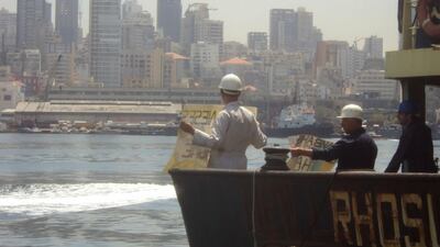 Crew of the Rhosus stage a protest aboard the arrested cargo vessel in the port of Beirut, Lebanon in 2014. Boris Musinchak / Reuters