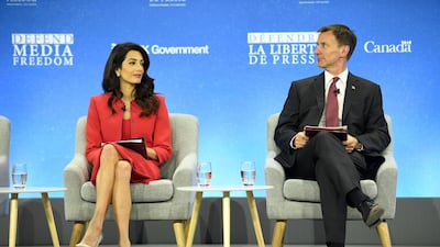Human rights barrister Amal Clooney and Britain's Foreign Secretary Jeremy Hunt attend a discussion at the Global Conference on Press Freedom on July 10, 2019 in London, England. Photo by Leon Neal/Getty Images