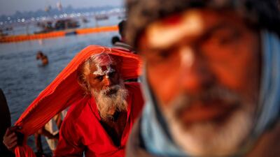 Sadhus or Hindu holy men leave after taking a holy dip at Sangam, the confluence of the Ganges, Yamuna and Saraswati rivers, during 'Kumbh Mela', or the Pitcher Festival, in Prayagraj, previously known as Allahabad, India. REUTERS