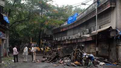 July 15 2011: Indian policemen stand at the blast site at Opera House business district in Mumbai, India. According to media reports, investigators were examining security camera footage for clues to the Mumbai triple bomb blasts that killed 17 people, an???