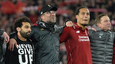 Jurgen Klopp. players Mohamed Salah, and Virgil van Dijk celebrate. EPA