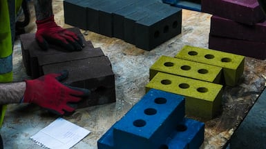 Green methods of construction, such as bricks made from recycled materials, could hold the key to the sector reaching net zero. Photo: Kenoteq