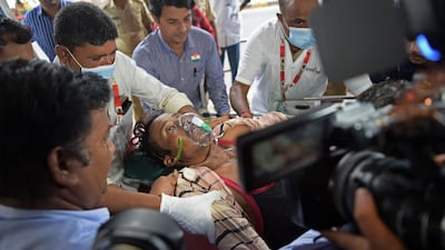 A man is taken to hospital in Ahmedabad after drinking bootleg alcohol. AFP