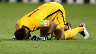 Qatar's Saad Al Sheeb celebrates after the match.