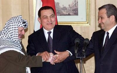 Israeli Prime Minister Ehud Barak (right) shakes hands with Yasser Arafat (left), President of the Palestinian National Authority, in Egypt at a summit in 2000. In between them is Egyptian president Hosni Mubarak. Reuters
