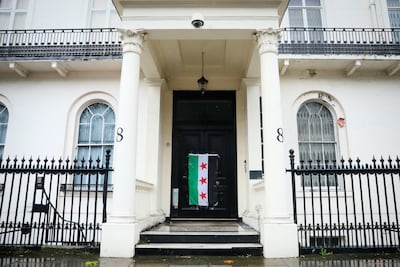 A Syrian flag on the door of the abandoned embassy in London after the fall of the Assad regime in December 2024. Getty Images