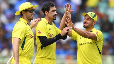 Australia bowler Mitchell Starc celebrates after the dismissal of India captain Rohit Sharma for 13. AFP