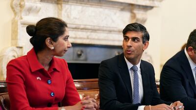 Ms Braverman listens to Britain's Prime Minister Rishi Sunak as he hosts a policing roundtable at 10 Downing Street in October. She courted controversy throughout her time in Cabinet and is believed to have designs on the leadership of the Conservative Party. AP