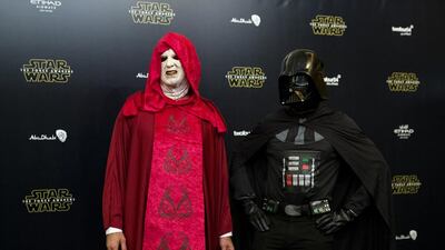 People dressed as characters from the film walk the ‘black carpet’ ahead of the Star Wars: The Force Awakens Middle East premiere at Emirates Palace in Abu Dhabi on December 16, 2015. Christopher Pike / The National