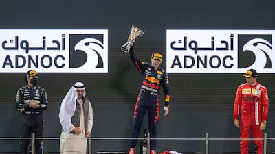 Race winner and 2021 F1 World Drivers Champion Max Verstappen of Netherlands and Red Bull Racing celebrates on the podium during the F1 Grand Prix of Abu Dhabi at Yas Marina Circui. Victor Besa/TheNational.