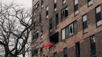 Broken windows and charred bricks scar the exterior of the 19-storey residential building. AFP