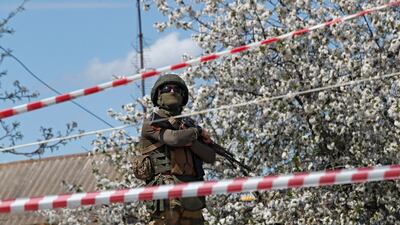 A pro-Russian troop stands guard in Bezimenne, Donetsk. Reuters