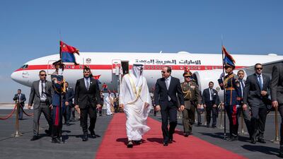 Sheikh Mohamed walks with President Sisi at the airport. Mohamed Al Hammadi / Ministry of Presidential Affairs