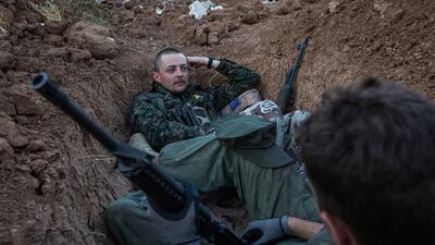 Hewal Sores, left, a 21-year old from the UK and Hewal Agir, a 23-year-old from the US, nick-named by Kurdish fighters, guard a post in the outskirts of the north-western Syrian town of Tal Tamr, near the border with Turkey, on April 19, 2015. Uygar Onder Simsek/AFP Photo