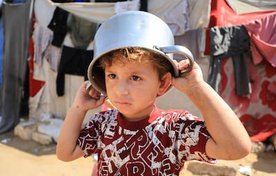A Palestinian child at a displacement camp in Gaza city. Reuters