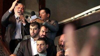 Hamas leader Ismail Haniyeh (L, top) speaks to Muslim worshippers following Friday noon prayer at Al Azhar mosque, in Cairo.