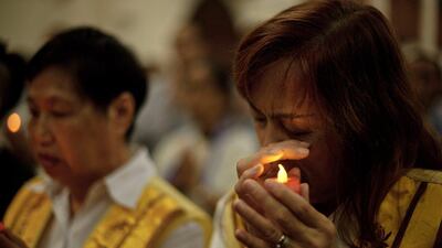 A Malaysian Buddhist wipes her tears as she offers prayers for passengers of missing Malaysia Airlines flight MH370 at a Buddhist temple in Kuala Lumpur. Mohd Rasfan / AFP Photo March 31