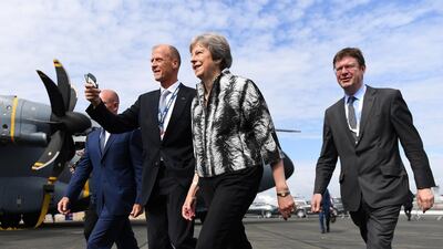 UK cabinet member Greg Clark (R), Prime Minister Theresa May (C) and Airbus CEO Tom Enders at the Farnborough Airshow. Mr Clark said the space industry could be worth almost $4bn to the UK. EPA