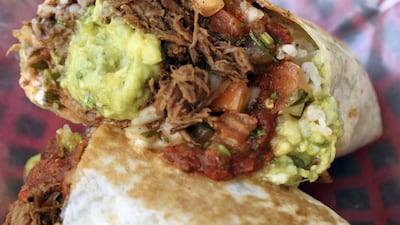 The pulled beef chuck burrito is a popular choice with a base price starting at Dh38. Chris Whiteoak / The National