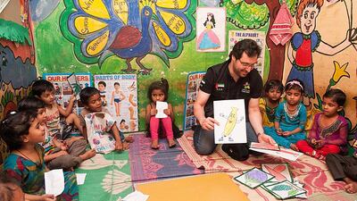 Dubai Cares chief executive Tariq Al Gurg with pupils in India who are being helped in an initiative run in conjunction with an Indian NGO. Courtesy Dubai Cares