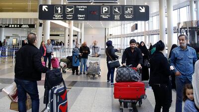Travellers at Rafic Hariri international check the flight schedule screens for delays or cancellations. Lebanon has a shortage of air traffic controllers. AFP