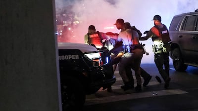 Police detain a person in Austin, Texas, during a rally in solidarity with the Los Angeles protests. Reuters