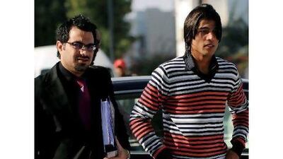 Mohammad Aamer, right, alongside his lawyer, who is confident the ICC will exonerate his client of spot-fixing charges. Manan Vatsyayana / AFP