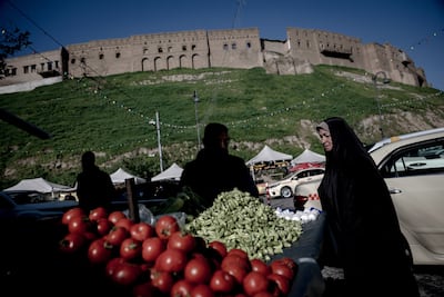Iraqi Kurds shop at a local market in Erbil. AFP