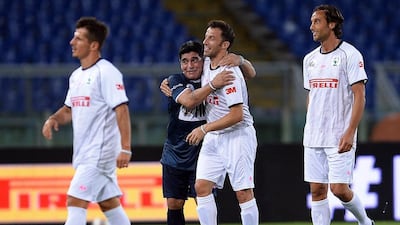 Italy great Alessandro Del Piero, left, is hugged by Diego Maradona at the “Match for Peace” in Rome’s Olympic Stadium on September 1, 2014. Filippo Monteforte / AFP