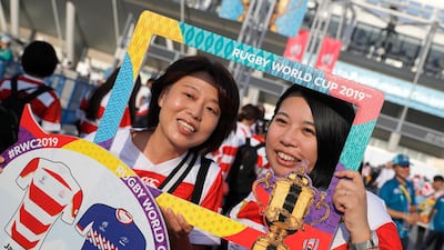 Japanese fans pose for a photo as they arrive at Tokyo Stadium. AP Photo