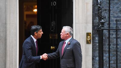 Rishi Sunak shakes hands with King Abdullah prior to their meeting. Bloomberg