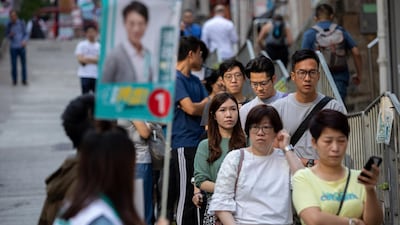 Long lines formed outside Hong Kong polling stations. EPA
