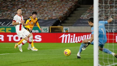 Southampton goalkeeper Alex McCarthy saves from Wolverhampton Wanderers' Pedro Neto. PA