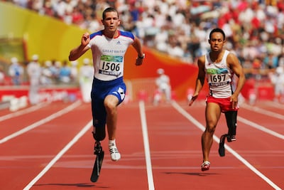 John McFall of Great Britain and Atsushi Yamamoto of Japan in the final of the men's 100m-T42 event at the 2008 Paralympic Games. Getty Images